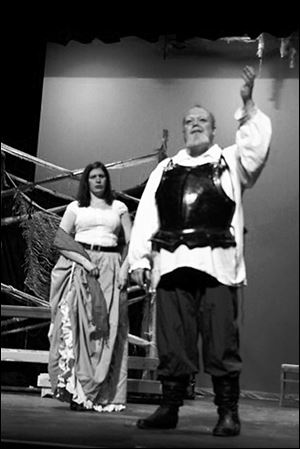 In the Ritz Players' production of  'Man of La Mancha,' Sean Joyce performs in the leading role as Don Quixote. Mandy Bour, portraying Aldonza, looks on.