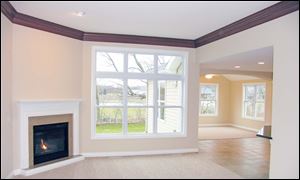 An open floor plan and large windows add to the feeling of spaciousness in the great room.
