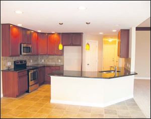 An expanse of granite offers plenty of work space in this efficient kitchen.