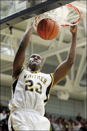 Whitmer's Nigel Hayes (23) dunks the ball against Central Catholic. The senior had 29 points and 13 rebounds for the Panthers in the final home game of his prep career.
