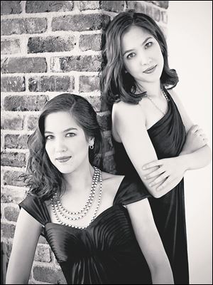Two pianists Christina and Michelle Naughton.