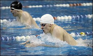 Christian Sobczak of St. Francis competes in the 200-yard individual medley at the Division I district. The Knights won their 47th dis­trict ti­tle with 411 points.