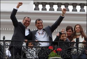 Ecuador's President and candidate for re-election Rafael Correa, top right, and vice presidential candidate Jorge Glass, top left, celebrate Sunday after presidential elections in Quito, Ecuador. Although official results had still not been released, Correa celebrated his second re-election as Ecuador's president after an exit poll showed him leading by a wide margin.