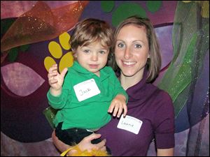 Jack, 1, and his mom Laurie Boudreaux just moved to toledo from Louisiana. Since they were missing Mardi Gras back home, they attended the Toledo Animal Shelter Association's Pardi Paws event.