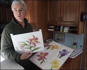 David Herzig holds some of his botanical studies at his home in Monclova Township.