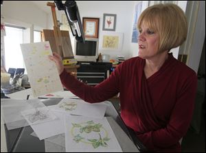 Deborah Kopka in her Perrysburg studio with a palette of color she sued in a recent painting.