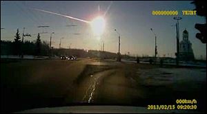In this photo from a dashboard camera, a meteor streaks through the sky over Chelyabinsk, Russia.