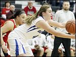  Anthony Wayne's Sara Zankl, right, and Lima Senior's Stacia Allen chase a loose ball during their Division I girls sectional Tuesday night in Tontogany. Zankl scored eight points in the Generals' loss.