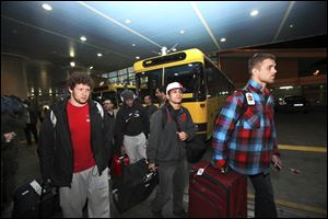 U.S. freestyle wrestling team members arrive at the Imam Khomeini airport in Tehran, Iran, early today to attend World Cup tournament. 