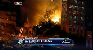 In this image taken from video from KCTV, firefighters battle a massive fire today at Country Club Plaza in Kansas City, Mo.
