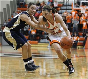 Chrissy Steffen, who led Bowling Green with 17 points, drives against Akron's Taylor Ruper in Wednesday night’s game at the Stroh Center. The Falcons are 17-8 overall, 8-4 in the MAC.