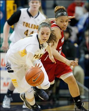 Toledo's Naama Shafir steals the ball from Northern Illinois player Alicia Johnson.