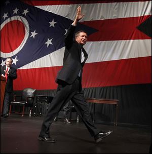 Ohio Gov. John Kasich waves goodbye after giving his State of the State address at the Veteran's Memorial Civic & Convention Center in Lima, Ohio.