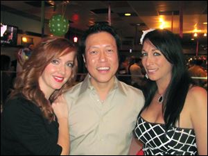 From left, Sara Yu and her husband Li Yu, owners of Spicy Tuna Sushi Bar, with Deitra Hickey, owner of Serenity Health and Wellness Center, hosted the 2013 charity event for autism.