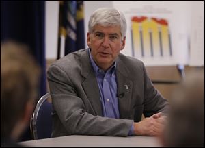 Michigan Gov. Rick Snyder said that he's at least a week away from deciding if Detroit needs an emergency manager to confront its $327 million budget deficit and $14 billion long-term debt. 