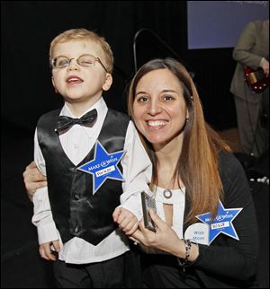 Make-A-Wish child Parker, 5, is all dressed up with his mother, Holly Kollars, for the Make-A-Wish foundation benefit.