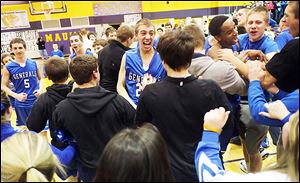 Anthony Wayne players and fans celebrate after beating Maumee to seal an outright Northern Lakes League championship.