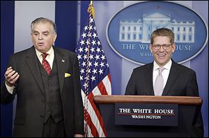 White House Press Secretary Jay Carney, at podium, and Transportation Secretary Ray LaHood discuss the likelihood of  a sequester and thus, budget cuts.