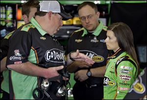 Daytona 500 pole sitter Danica Patrick, right, talks on Friday to crew chief Tony Gibson during a practice for the Daytona 500 NASCAR Sprint Cup Series auto race at the Daytona International Speedway.