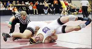 Bryan wrestler Brock Nagel finds himself on his back against Luke Cramer of Oak Harbor during their 170 pound district final. Cramer won the match with a 17-2 technical fall.