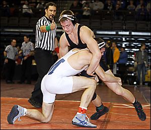 Delta Tyler Fahrer, right, fends off Adam Guerra of Sandusky St. Mary. Fahrer won 6-0 to take the 145-pound title and help the Panthers win the team crown.