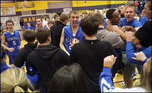 Anthony Wayne players and fans celebrate after beating Maumee and winning the NLL on Friday night at Maumee High School.