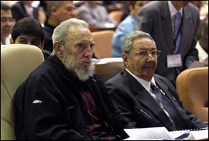 Cuba's President Raul Castro, right, and brother Fidel Castro attend the opening session of the National Assemby on Sunday in Havana. Cuban President Raul Castro says he will not seek another five year term after the one he's starting today ends.