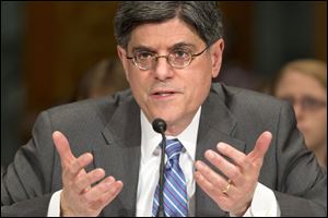 The chairman of the Senate Finance Committee says the committee will vote on Tuesday on the nomination of former White House chief of staff Jack Lew to be treasury secretary.