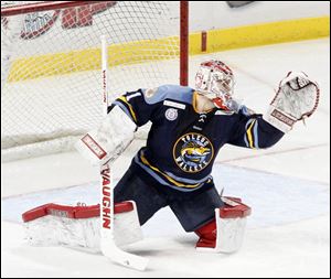 Walleye goalie Jordan Pearce stops the puck against Cincinnati. He finished with 25 saves on Sunday.