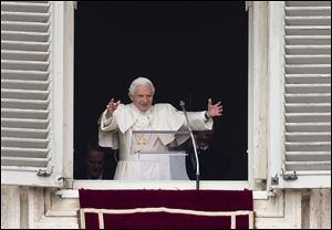 Pope Benedict XVI gives his blessing in his last Angelus noon prayer. At Sunday’s service, cheers from the packed St. Peter’s Square greeted the retiring Pontiff, 85.
