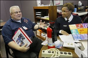 Volunteer Gerry Tremblay and Toledo Firefighter Gwen Haynes-Burel work with the Seniors Advocates for Fire Education (SAFE) program. It is a collaboration among several organizations.