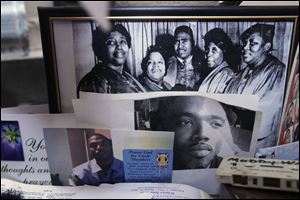 A photo shrine memorializes La’Sean Robinson, who was murdered June 10, 2012, on his 29th birthday. Charles C. McCuin pleaded guilty Friday in the slaying.
