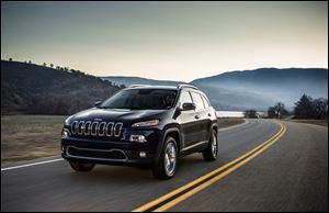 Chrysler released photos of its soon-to-be unveiled 2014 Jeep Cherokee Limited after unauthorized pictures circulated on an automotive Web site.