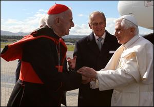 Pope Benedict XVI, right, is greeted by  Cardinal Keith O'Brien  in Edinburgh, Scotland, in September, 2010.