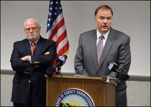 Jim Ruvolo, left, and Jon Allison, who were appointed by Secretary of State Jon Husted as consultants to review the Lucas County Board of Elections make their recommendations public during a news conference at One Government Center.