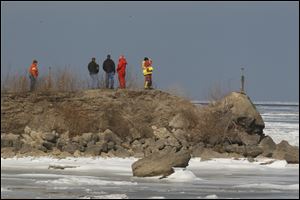 Authorities search for a man thought to have fallen through the ice in Lake Erie near Oak Harbor.