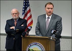 Jim Ruvolo, left, and Jon Allison recommend an overhaul of the Lucas County Board of Elections operating procedures.
