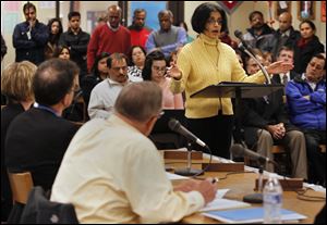 The director of food service Savita Jindal defends herself during a Sylvania school board meeting at Southview High School. The board terminated her employment.