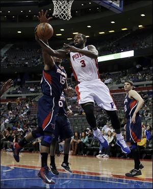 Detroit Pistons guard Rodney Stuckey (3) shoots a layup against Atlanta Hawks center Al Horford (15)  during the second half of an NBA basketball game at the Palace inAuburn Hills.