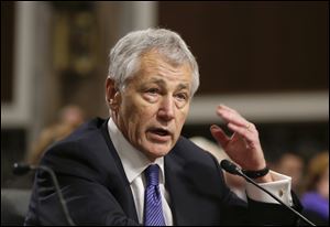 Chuck Hagel, shown here in his testimony before the Senate Armed Services Committee, was confirmed today as the new secretary of defense.