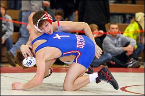 Bedford senior Mitch Rogaliner defeats Trevor Zbedski in the 119-pound Division 1 regional final. Rogaliner has a career record of 201-14 and wants to be the first three-time state champion in school history. He won the title as a freshman and junior and finished runner-up as a sophomore.