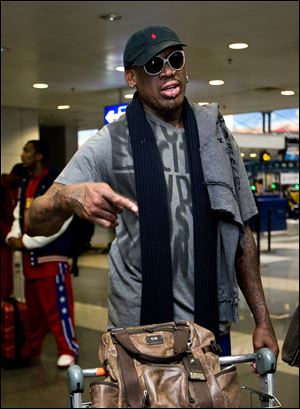 Former NBA star Dennis Rodman speaks at the departure hall of Beijing Capital International Airport in Beijing as he and three members of the Harlem Globetrotters basketball team, a VICE correspondent and a production crew from the company are visiting North Korea to shoot footage for a new TV show set to air on HBO in early April.