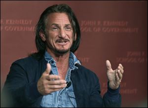 Actor-director Sean Penn gestures as he participates in a discussion at Harvard University's John F. Kennedy School of Government today in Cambridge, Mass.
