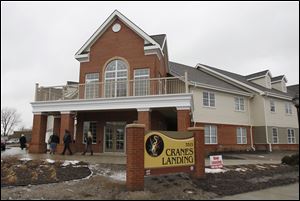 Visitors tour the Crane's Landing independent senior apartment complex on Chase Street in Toledo, following a grand opening ceremony, today.
