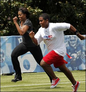 First lady Michelle Obama runs a 40-yard sprint during the Let's Move! Campaign and the NFL's Play 60 Campaign festivities with area youth, to promote exercise and fight childhood obesity, in New Orleans in September, 2010.