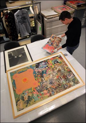 Matt Seaman, collections assistant, handles the Rolling Stones album 