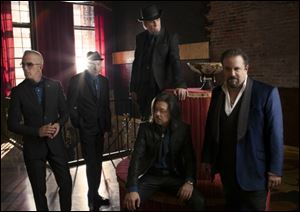 From left, Paul Deakin, Jerry Dale McFadden, Robert Reynolds, Eddie Perez (seated), and Raul Malo of the Mavericks.