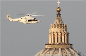 A helicopter with Pope Benedict XVI onboard leaves the Vatican in Rome.