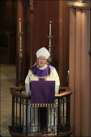 Bishop Leonard Blair during Mass delivers a homily during a mass for Pope Benedict XVI, who is resigning, at St. Francis de Sales chapel.