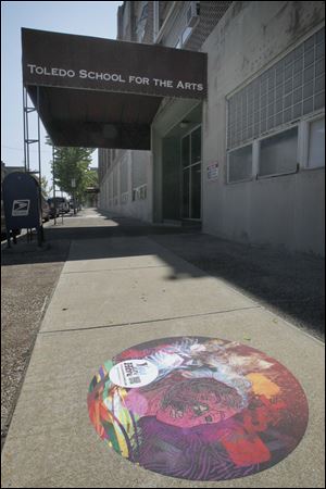 A dot in front of the Toledo School for the Arts was a part of the You Are Here project that has won a design award. 